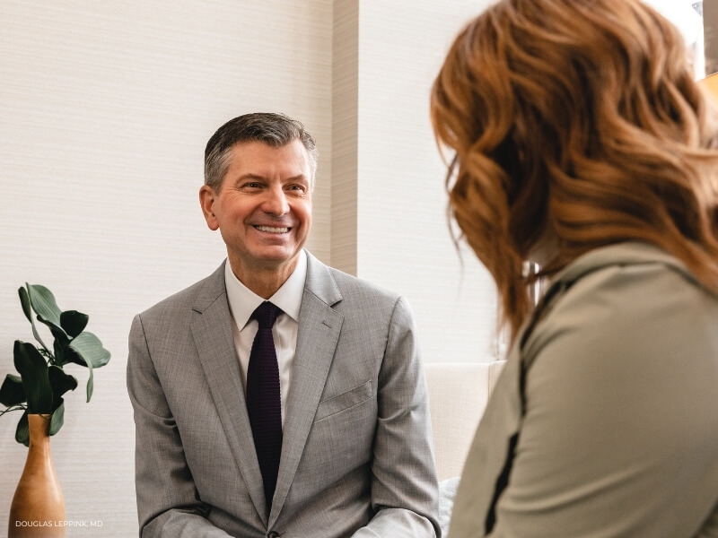 Surgeon discussing breast augmentation options with a patient at Centre for Plastic Surgery.